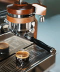 Kickstart Your Brew Routine With Top Shelf 58mm Bottomless Portafilter Featuring Beefy Aluminum Handle And Cranked 18g Double Shot Basket For Breville Espresso BES900XL BES920XL BES980XL BES990BSS For Smooth Shot Vibes Daily, showcasing sleek design and coffee shot.