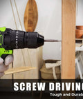 COMOWARE cordless drill side view with bit drilling into wood; green and black body.