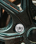Close-up of wheel with wet surface, showcasing Heavy Duty Wheel Hub Flange Bolts Nuts For ATV And Go Kart.