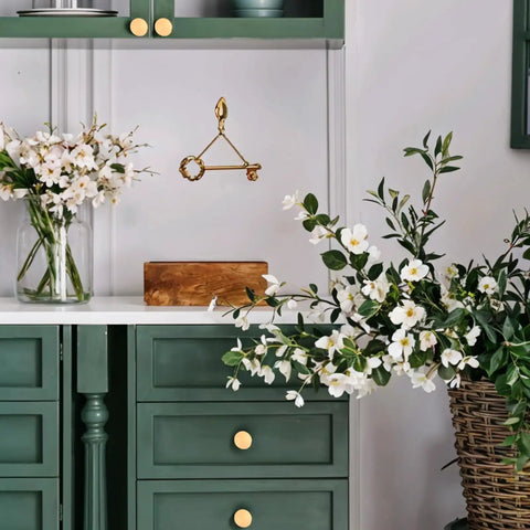 Room with green cabinet drawers featuring Two Pack Matte Gold Bifold Closet Door Knobs, Round Cabinet and Drawer Knobs for Wardrobe, Dresser.