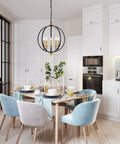 Five Light Farmhouse Pendant Lantern Chandelier In Black With Adjustable Height Chain over dining table in modern kitchen