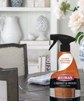 Heavy Wood Cabinet Cleaner Spray Brings Back Straight Up Shine With Zero Oily Mess For Kitchen Cupboards Furniture Tables Baseboards Trim Includes Plush Microfiber Rag Two Pack Sixteen Oz, placed on a round wooden table.