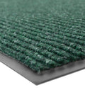 Corner view of Workhorse Heavy Duty Industrial Door Mat 3 Ft By 10 Ft Large Entrance Rug For Busy Commercial Entrances Lobbies Garages And Mudrooms Made In USA Hunter Green Brush Step 109S0310GN showing green texture and non-slip backing.