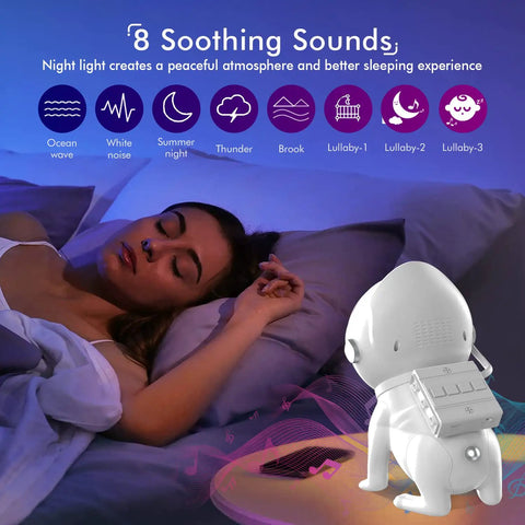 Woman sleeping under blue light with All In One Star Projector With Bluetooth Speaker, White Noise, Ocean Wave Night Light, And App Control