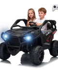 Two kids in a Powerful 24V Two Seater Ride On Car With 800W Motors, Four Wheel Drive and Two Wheel Drive Switchable, LED lights on