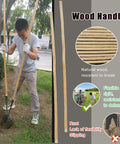Heavy Duty Manual Post Hole Digger featuring sturdy wood handle and razor sharp blades for crushing tough clay soil, in use.