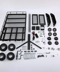 Heavy Duty Metal Trailer Cargo Carrier Kit For One Ten Scale RC Crawler Cars consisting of parts laid out including tires, steel frame, and accessories.