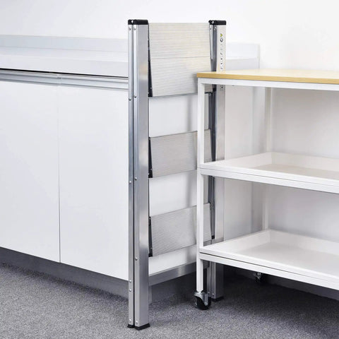 Aluminum 3 Step Folding Ladder Lightweight Portable Slim Step Stool 330 Lb Capacity Multi Function Safety Stepladder Rust Resistant And Grab And Go Easy To Store Silver, folded beside table