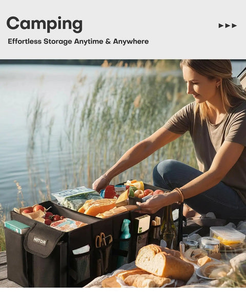 Woman using Foldable Car Trunk Organizer With Three Compartments And Six Mesh Pockets, Heavy Duty Storage at a picnic by a lake.