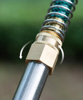 Brass Garden Hose Adapter 3/4 GHT Female To 3/4 NPT Female Swivel Connector attached to hose and pipe fitting
