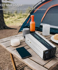 Solid 1000 Watt Pure Sine Wave Inverter Yanks Quick 48 V DC And Turns It Into Smooth 110 120 V AC With Dual Outlet Plugs And Crisp LED Display Off Grid Portable Power Converter Ready For RV Builds And Backyard Hangouts on picnic table next to camping gear.