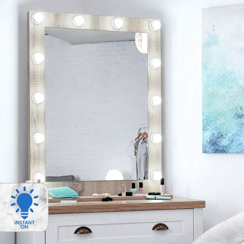 Vanity mirror with bright bulbs on a dresser, Pack Of 6 A19 LED Light Bulbs 60W Equivalent 5000K Bright White 800 Lumens visible.