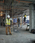Construction worker using NGT 25 Foot Tape Measure With One And A Quarter Inch Tape For Quick Accurate Measurements on site