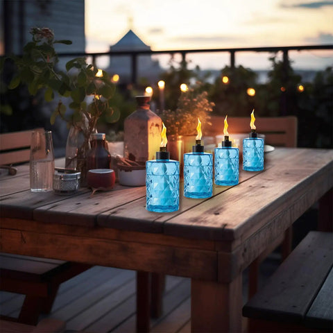 4 Pack Glass Table Top Torches With Wick And Cap, Multicolor Citronella Lanterns For Outdoor Yard Patio Deck Garden displayed on a table
