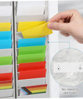 Hand inserting a yellow card into Heavy Duty 28 Slot Guest Room Key And Badge Organizer Rack for easy access.
