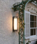 ROPCVAX Led Wall Sconce Lighting Fixture Lamp Modern Minimalist Aluminum Black mounted on exterior wall with soft illumination.