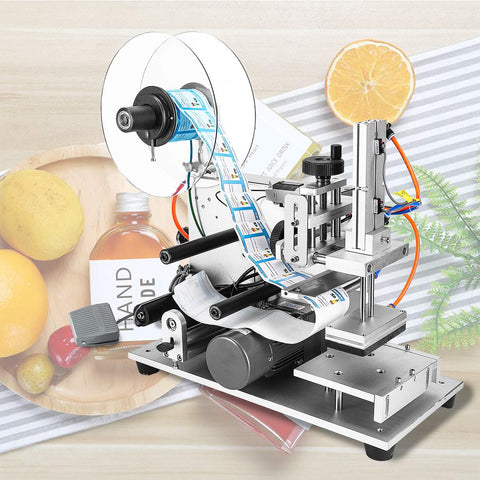 Rock Solid Semi Automatic Plane Labeling Machine With Adjustable Applicator For Flat Bottles applying labels in a kitchen setting.