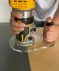 Person using Dead On Accurate Router Base Plate Compatible With DWP611 And DCW600B 6X9 Inch Clear Acrylic for woodworking.