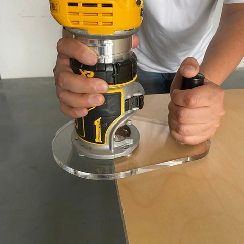 Person using Dead On Accurate Router Base Plate Compatible With DWP611 And DCW600B 6X9 Inch Clear Acrylic for woodworking.