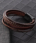 Fresh Brown Braided Leather Bracelet For Men And Women Unisex Premium PU Leather Wristband Jewelry on textured surface.