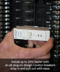 Hand installing 30 Space Indoor Load Center With 150 Amp Main Breaker, No Fuss Rough In Wiring, close-up view
