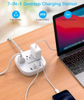 20W USB C Desktop Power Strip With 3 AC Outlets, 3 USB-A Ports, And 1 USB-C Fast Charge on desk with laptop and phone