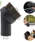 Horsehair round brush from Eight Piece Vacuum Attachment Kit For One And A Quarter Inch Vacuums Including Crevice Tool, Horsehair Round Brush, Utility Nozzle With Brush, Upholstery Tool, Brush And Nozzle Combo, And Two Extension Tubes, used for cleaning car interiors and surfaces.
