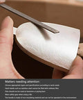 Using Needle File Set Six Piece Carbon Steel Tools Pro Grade to shape soft metal surface with flat file, close-up view.