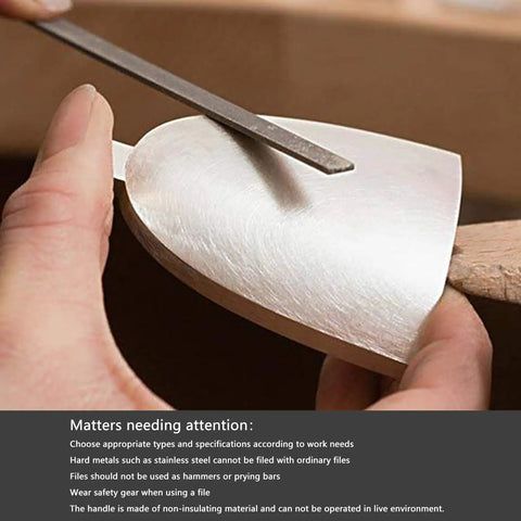 Using Needle File Set Six Piece Carbon Steel Tools Pro Grade to shape soft metal surface with flat file, close-up view.