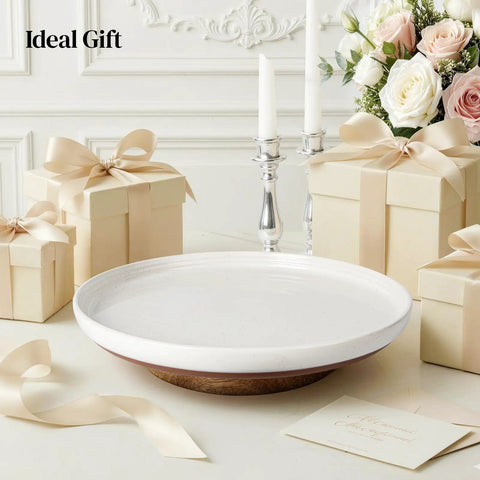 Super Smooth Spinning Ceramic Lazy Susan Tray With Natural Acacia Wood Base Round Rotating Kitchen Counter Organizer And Farmhouse Condiment Holder Totally Game Changer displayed with candles and gift boxes.