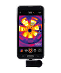 Front view of Compact All Purpose Thermal Imaging Camera For Android USB C Turns Your Phone Into A Real World Thermal Cam For Home Jobsite And More Spot Energy Loss Electrical And Mechanical Faults Water Damage And Hidden Issues attached to an Android phone displaying a thermal image.