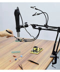 Third Hand Soldering Station With Adjustable Gooseneck Arms And PCB Holder Welding Help Tool in use on a table