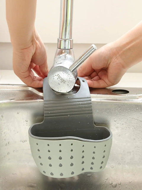 Double Deck Faucet Mount Kitchen Sink Organizer With Adjustable TPR Rubber Sponge Soap And Scrubber Storage Basket, gray, attached to sink.