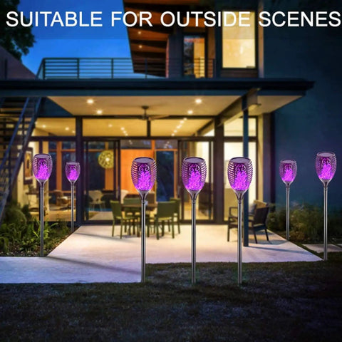 Solar Tiki Torch Lights Eight Piece Purple Outdoor Garden Decor With Realistic Flickering Flame by a modern patio