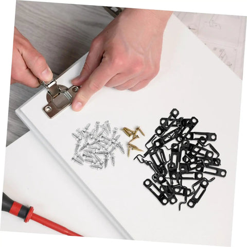 Hands assembling 30 Piece Hidden Furniture Connectors Toolless Cabinet Joint Brackets with black clips and screws on a work surface.