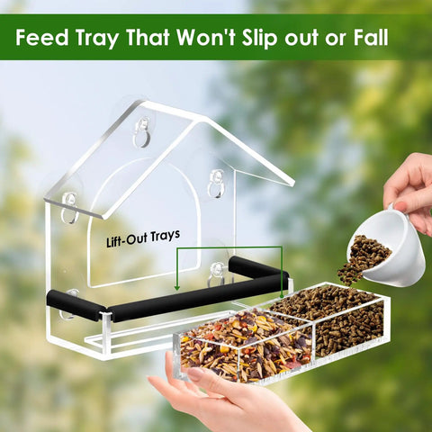 Clear Window Bird Feeder With Five Extra Strong Suction Cups shown with lift-out trays being filled with birdseed