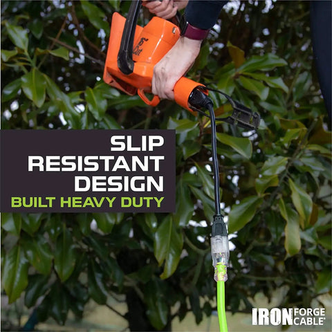 Man using High Visibility 100 Ft Outdoor Extension Cord 16/3 SJTW 13 Amp Heavy Duty Neon Green With Lighted End for power tools