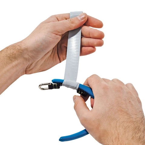 Attaching pliers with tape to Squids 3180 Tool Tethering Kit For 2lb Tools ANSI ISEA 121-2018 Compliant Ultra Strength Nylon Coiled Lanyard.