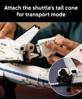 Close-up of hands assembling Shuttle Carrier Aircraft Building Set For Adults Ages 18 Plus Dope Boeing 747 And NASA Space Shuttle Enterprise