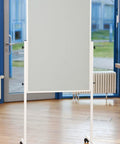Built Tough 2 Inch Black Twin Wheel Swivel Furniture Casters With Brake on a mobile whiteboard in a bright room