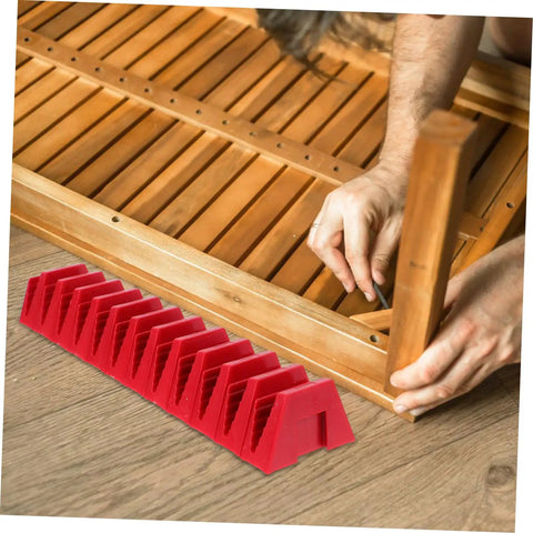 12 Piece Modular Wrench Organizer Tray for Workbenches Garages and DIY Projects Durable Plastic Tool Holder in red on floor