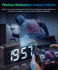 Super Sleek Hidden Camera Clock With 4K Wireless WiFi Surveillance detecting motion with alerts on phone while monitoring room.