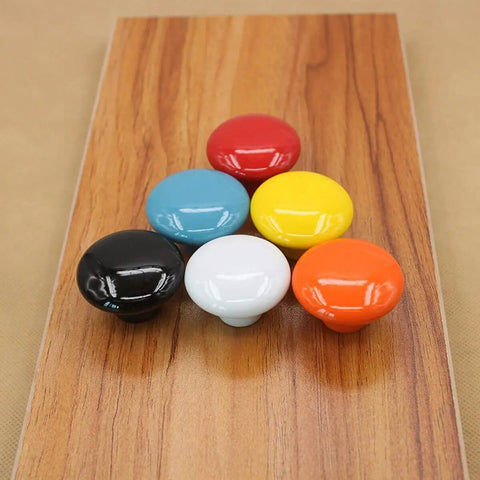 Absolute Game Changer Ceramic Mushroom Drawer Knobs And Cabinet Pull Handles Killer Aesthetic For Dressers And Kitchen Cupboards Rugged 15 Piece Set With Screws in various colors on wood.