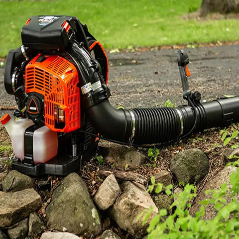 Backyard Beast Gas Backpack Blower With 220 MPH Air Speed 1110 CFM Air Flow 79.9cc 2 Stroke X Series Engine in use on rocky terrain