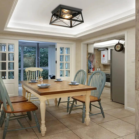 Two Light Flush Mount Ceiling Light Fixture In Matte Black With Open Cage Metal Frame in kitchen dining area