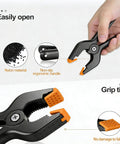 12 Pack Heavy Duty 4.5 Inch Spring Clamps With Grip Jaw Pads For Photography Studio Backdrops And Carpentry Projects in hand