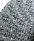 Close-up of a 4.5 inch diameter Zip Cut Off Wheel For Metal Cutting, 3/64 inch thick, 7/8 inch arbor, showing distinctive curved stripe pattern.