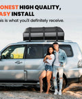 Couple with Rooftop Cargo Bag for Cars Waterproof 21 Cubic Feet on silver SUV parked on sand.