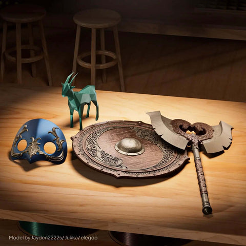 3D printed decorative items made with Metallic Bronze 1.75mm PLA Filament, 1kg Spool, including a shield, mask, and axe on a table.