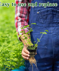 Person holding 2 Inch Aeration Cups Net Pots For Hydroponics With Slotted Mesh Pro Grade Heavy Duty Grow Basket in garden